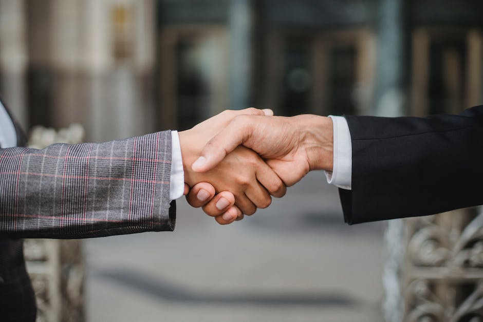 Image depicting a handshake between two people, symbolizing business relationships and gratitude.